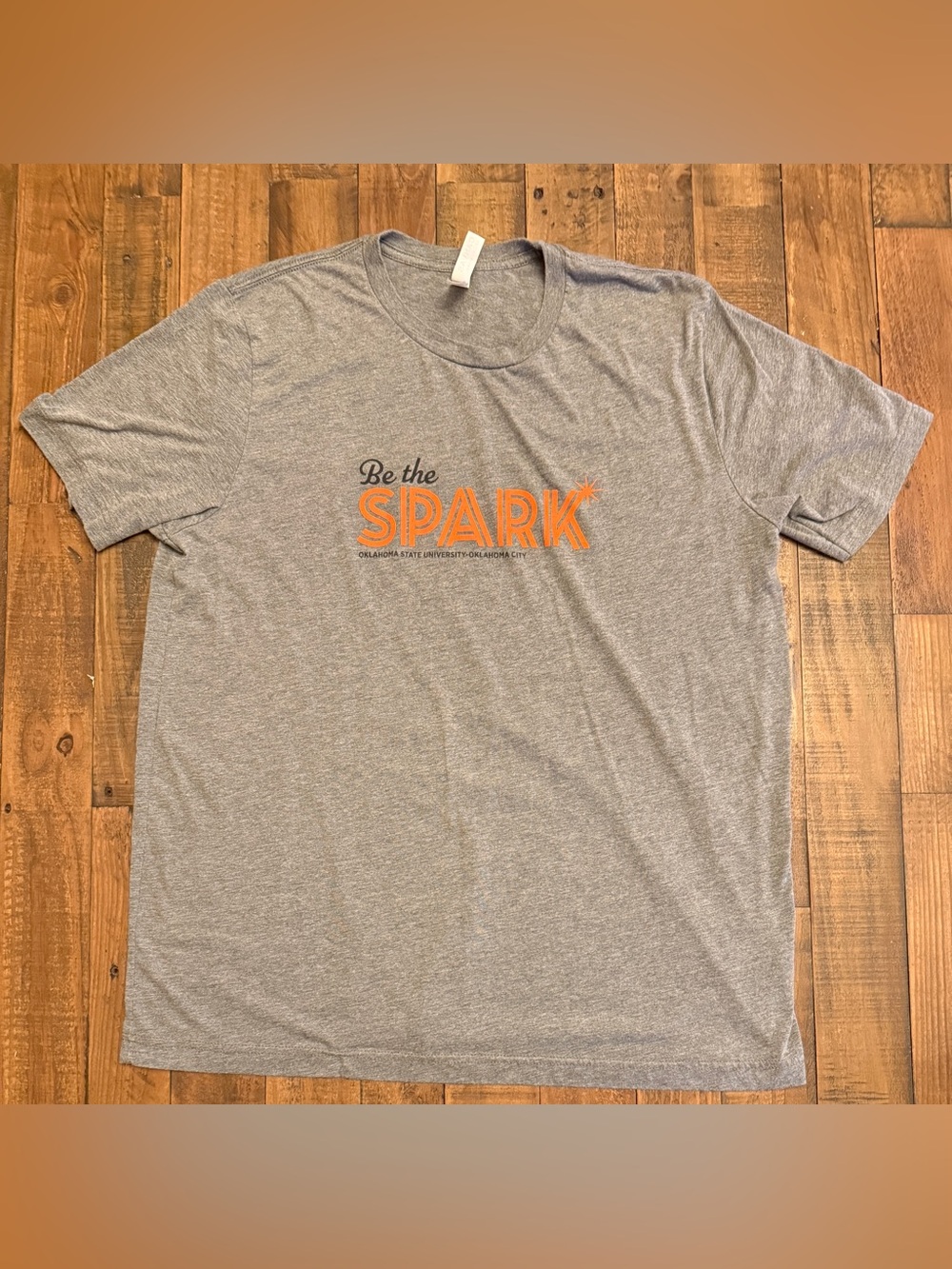 Bella + Canvas “Be the Spark” Oklahoma State University–Oklahoma City Graphic T